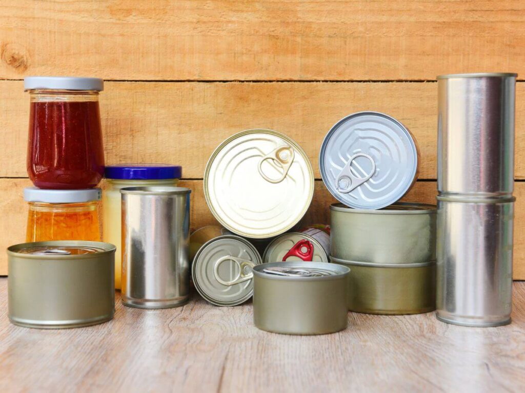 Image of assorted canned goods and jars prepared for emergencies, an important backup alongside a whole home generator in Michigan.